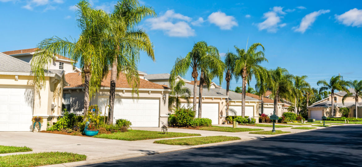 Typical,Gated,Community,Houses,With,Palms,And,Asphalt,Road,,South